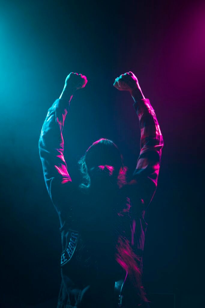 long-hair-artist-holding-hands-air-stage